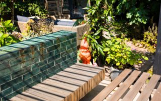 Brown garden bench attached to the wall