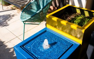 Small blue water feature on roof