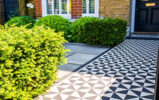 Victorian-style garden design front path with green bushes